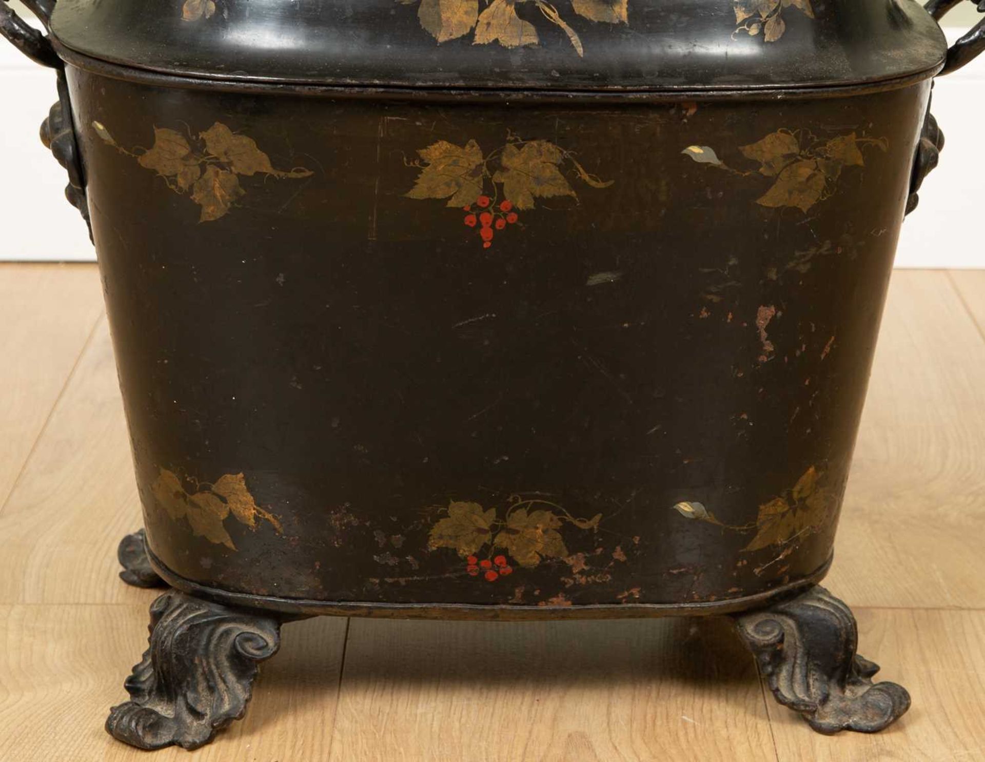 A 19th century Japanned coal vase decorated with flowers and with cast scrolling handles and feet, - Image 2 of 3