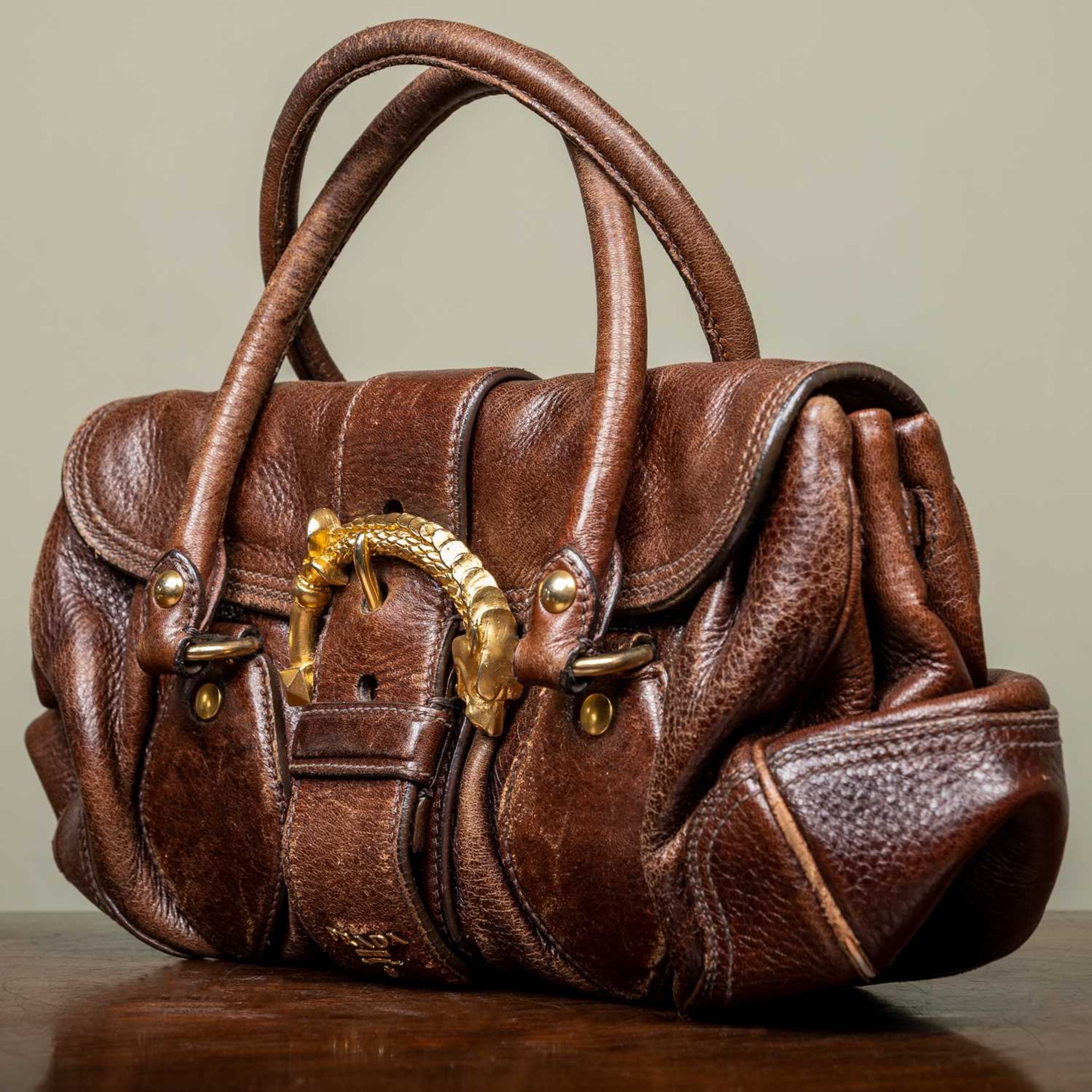 A ladies Prada Cervo dragon buckle brown leather bag with additional brown leather tags and - Image 3 of 10