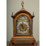 A late 19th century Winterhalder & Hofmeier oak bracket or table clock, the break arch brass dial