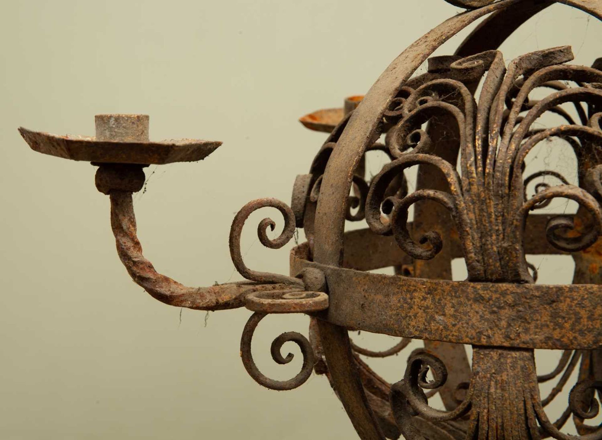 An early 20th century wrought iron hanging chandelier, the central globe with four branches and - Image 4 of 4