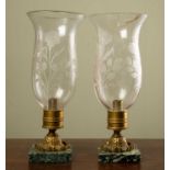 A pair of storm lamps with cut glass shades, gilt metal mounts and marble plinths, the shades