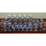 A suite of Venetian blue wine glasses in seven different sizes, the largest a group of five wine