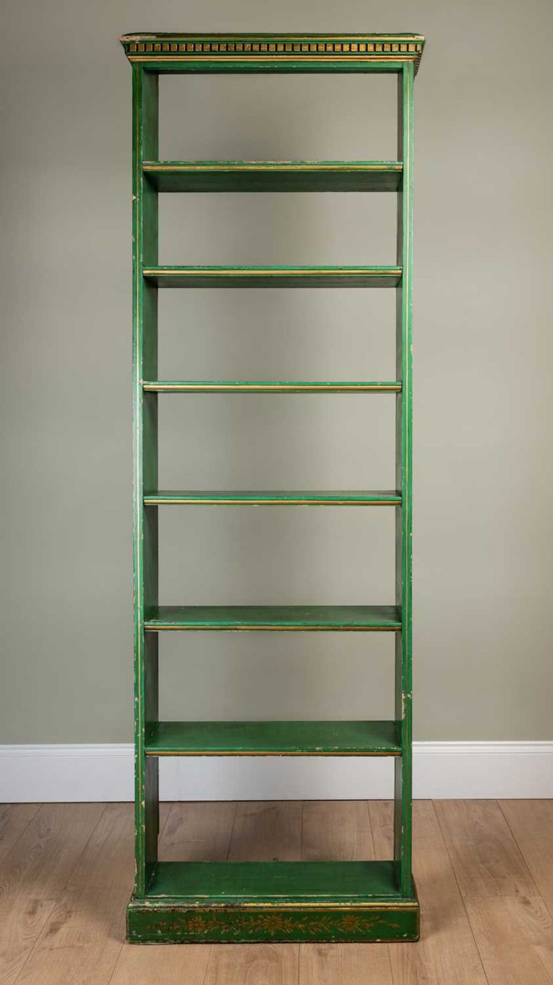 A contemporary Chinese style chinoiserie and green lacquered bookcase the side panels decorated with
