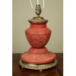 A decorative table lamp with Chinese cinnabar lacquer body and gilt metal mounts, 25cm diameter x