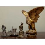 A carved giltwood eagle with spread wings, 34cm wide; together with a small bronze sculpture of a