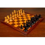 A Staunton club size chess set by Jaques of London, boxwood and ebony, together with the box and a