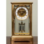 A 19th century French four glass mantle clock the two section dial with visible escapement, the