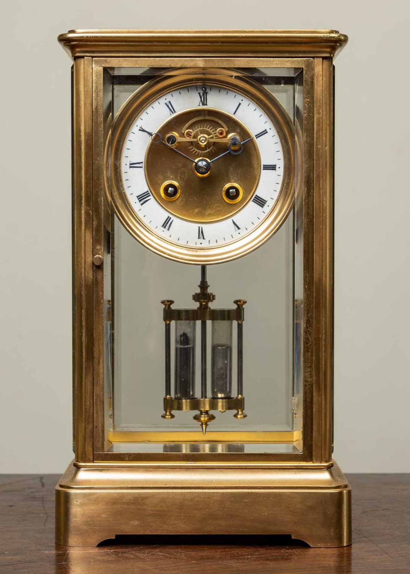 A 19th century French four glass mantle clock the two section dial with visible escapement, the