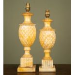 Two similar carved marble table lamps of pineapple form, fluted square base plinth bases, the