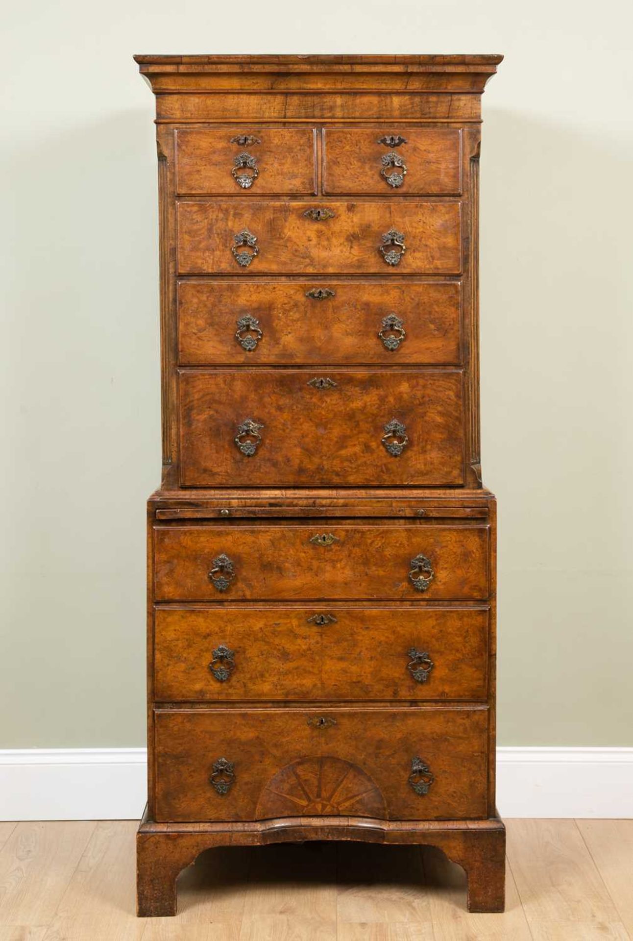 An 18th century-style walnut small sized chest on chest, the upper section with fluted canted corner