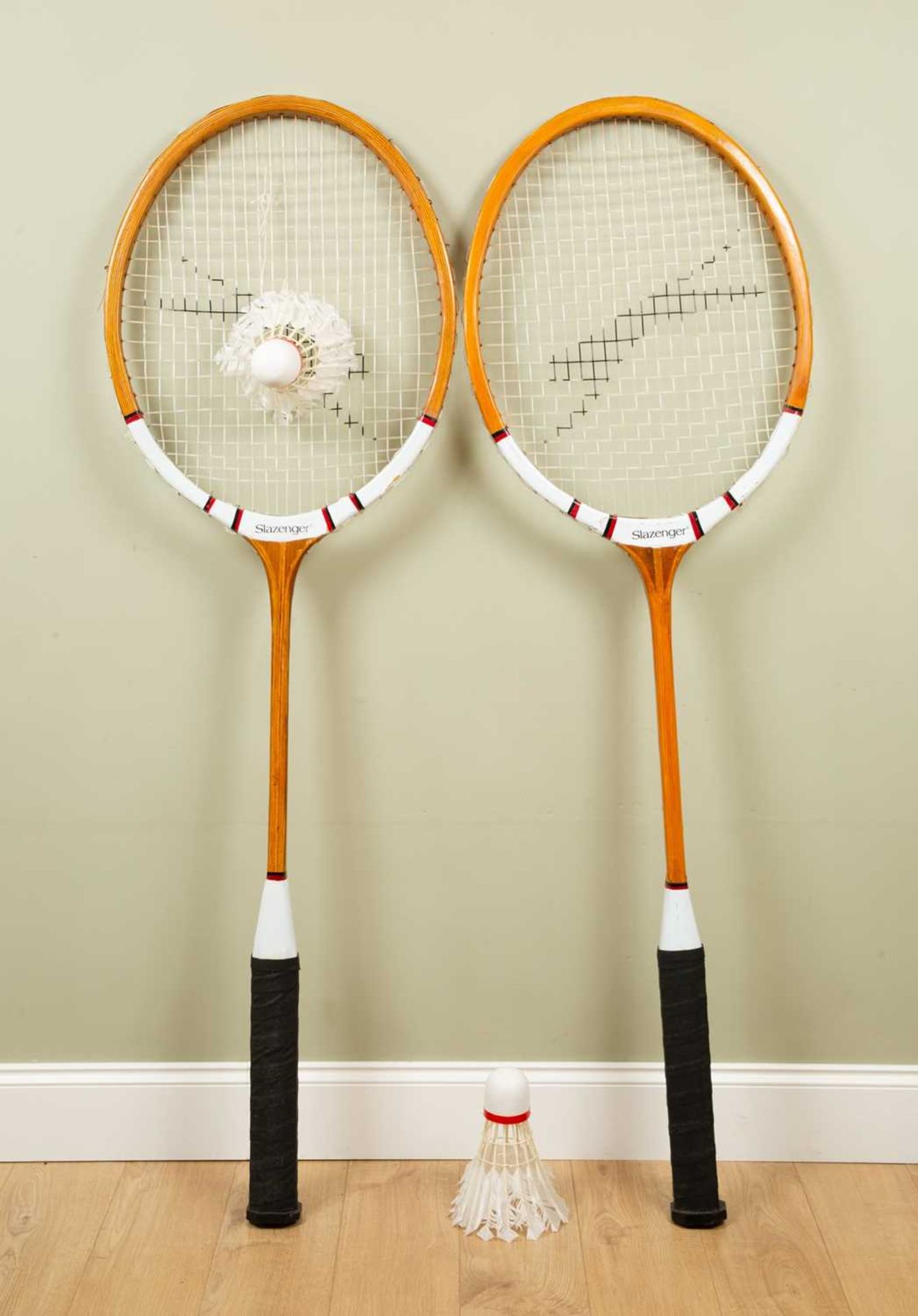 A pair of oversized shop display Slazenger badminton rackets, each 180cm high; together with a