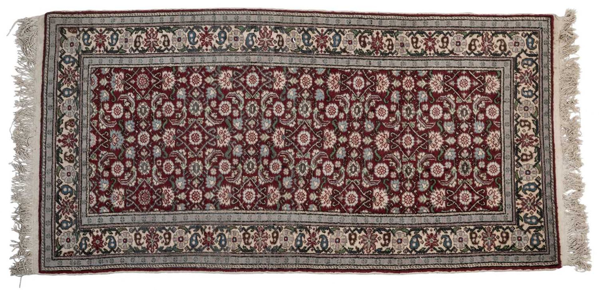 A small Turkey red ground rug together with a group of four further modern Oriental rugs (5)The - Image 3 of 11