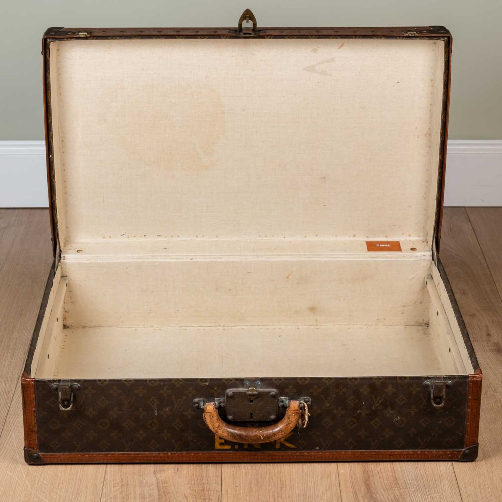 A vintage Louis Vuitton suitcase, early 20th century, with leather carrying handle, the lock - Image 7 of 11