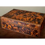 A 19th century Anglo-Indian tortoiseshell work box, the lid with decorative banded inlay opening