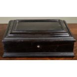 A late 18th or early 19th century possibly continental ebony box with moulded ornament to the lid,