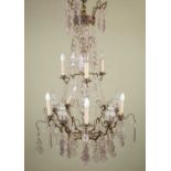 A French two-tier eight-light chandelier or electrolier with decorative glass finials, cut glass