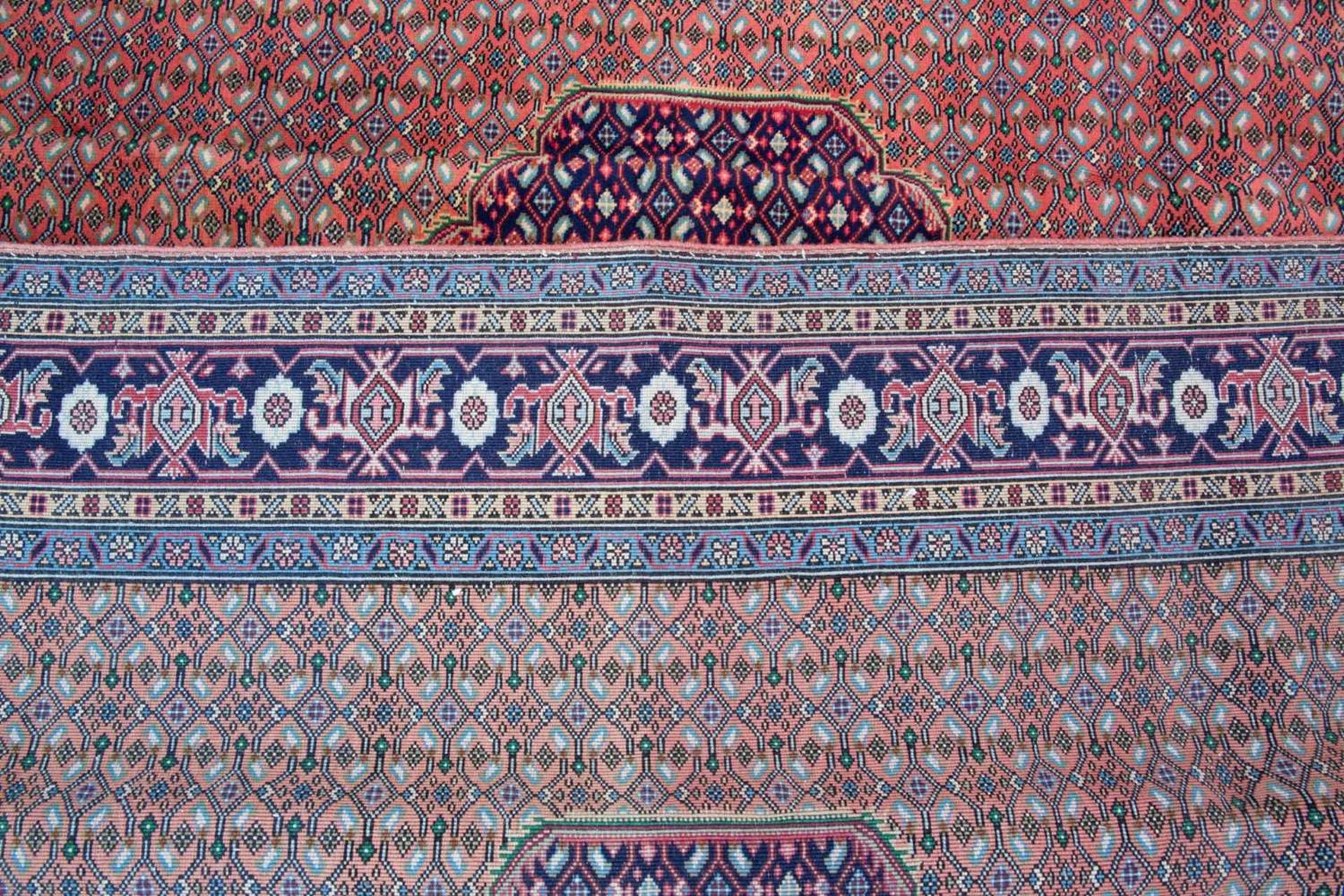 A Tabriz small carpet with geometric motifs to the central field, 290cm x 197cm Minor marks due to - Image 2 of 2