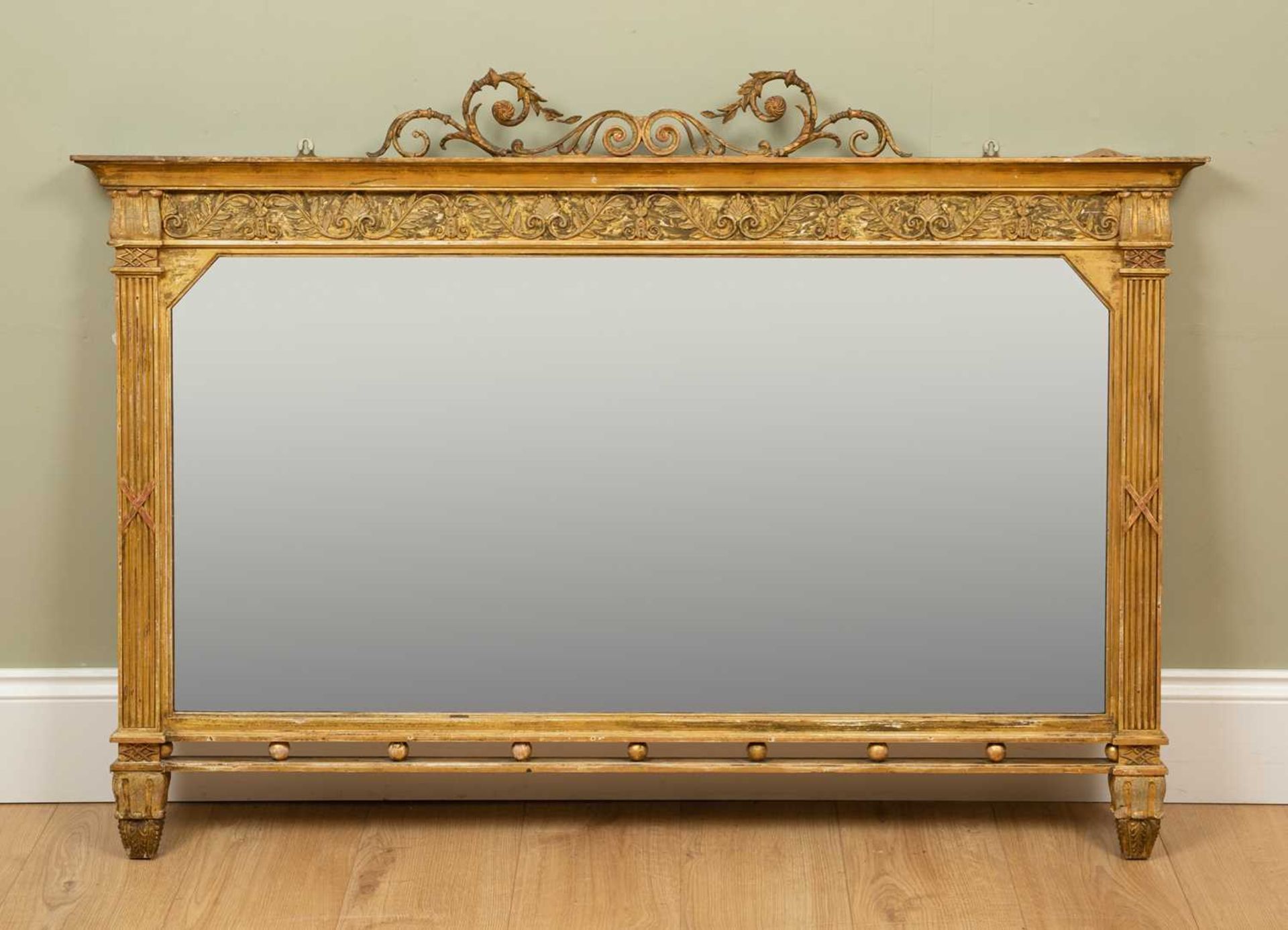 A 19th century gilt framed overmantle mirror, the scrolling crest above a frieze with classical