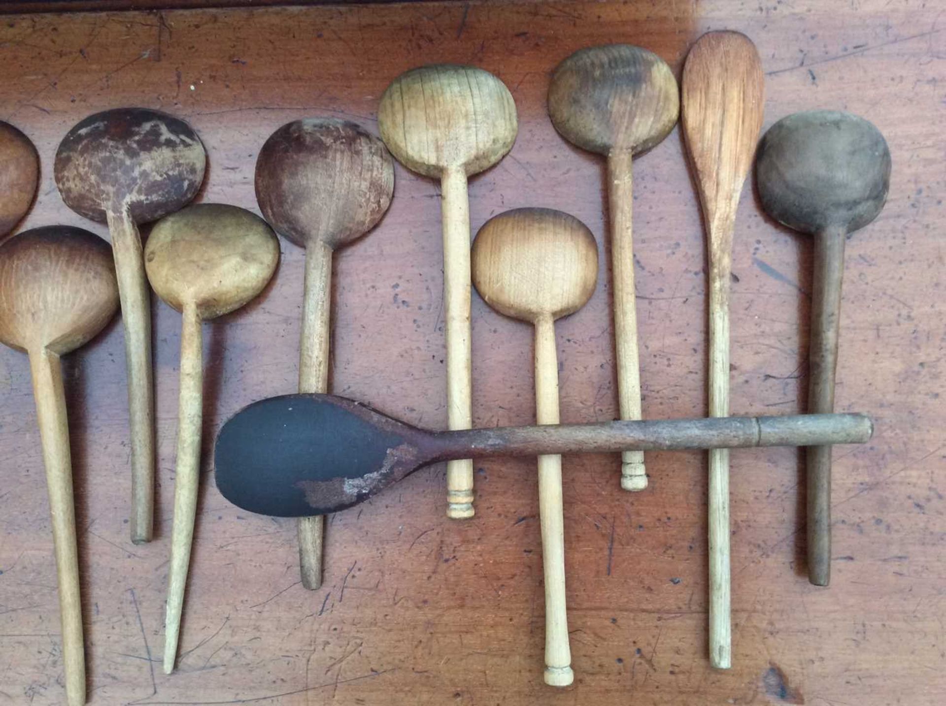 An antique sycamore dairy bowl, 37.5cm diameter; together with a pine spoon rack with a collection - Image 7 of 8