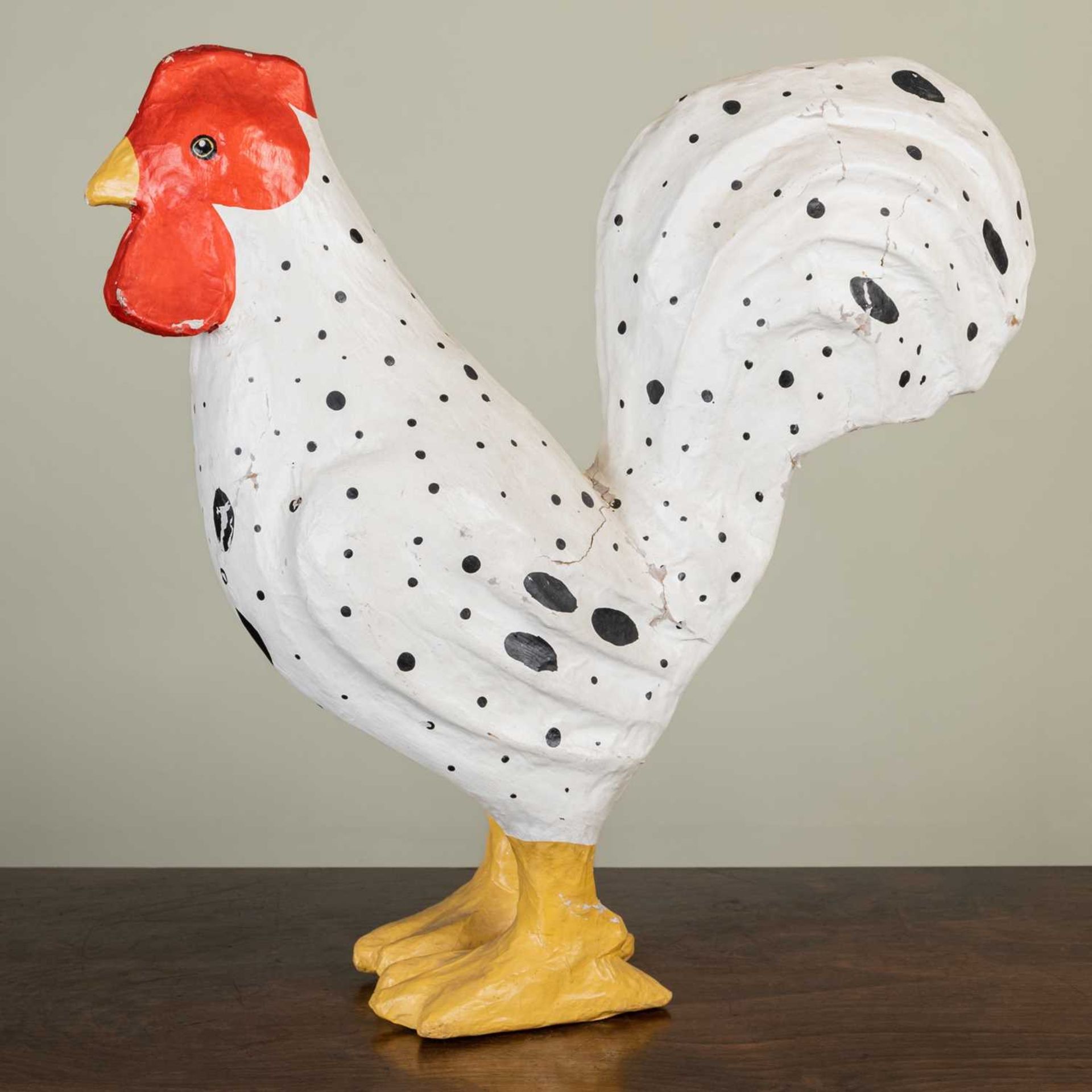 A painted contemporary papier-mâché model of a chicken, 37cm long x 39cm highSome cracks and marks