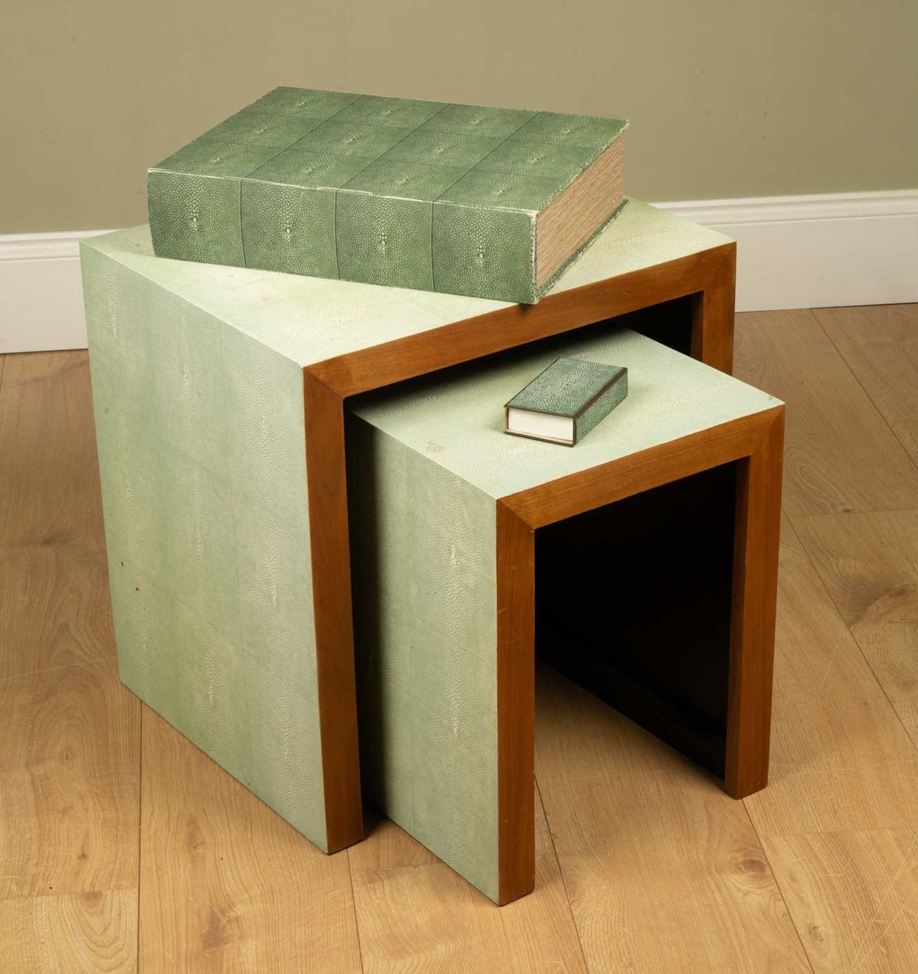 A collection of Oka faux shagreen to include a nest of two occasional tables, the larger table