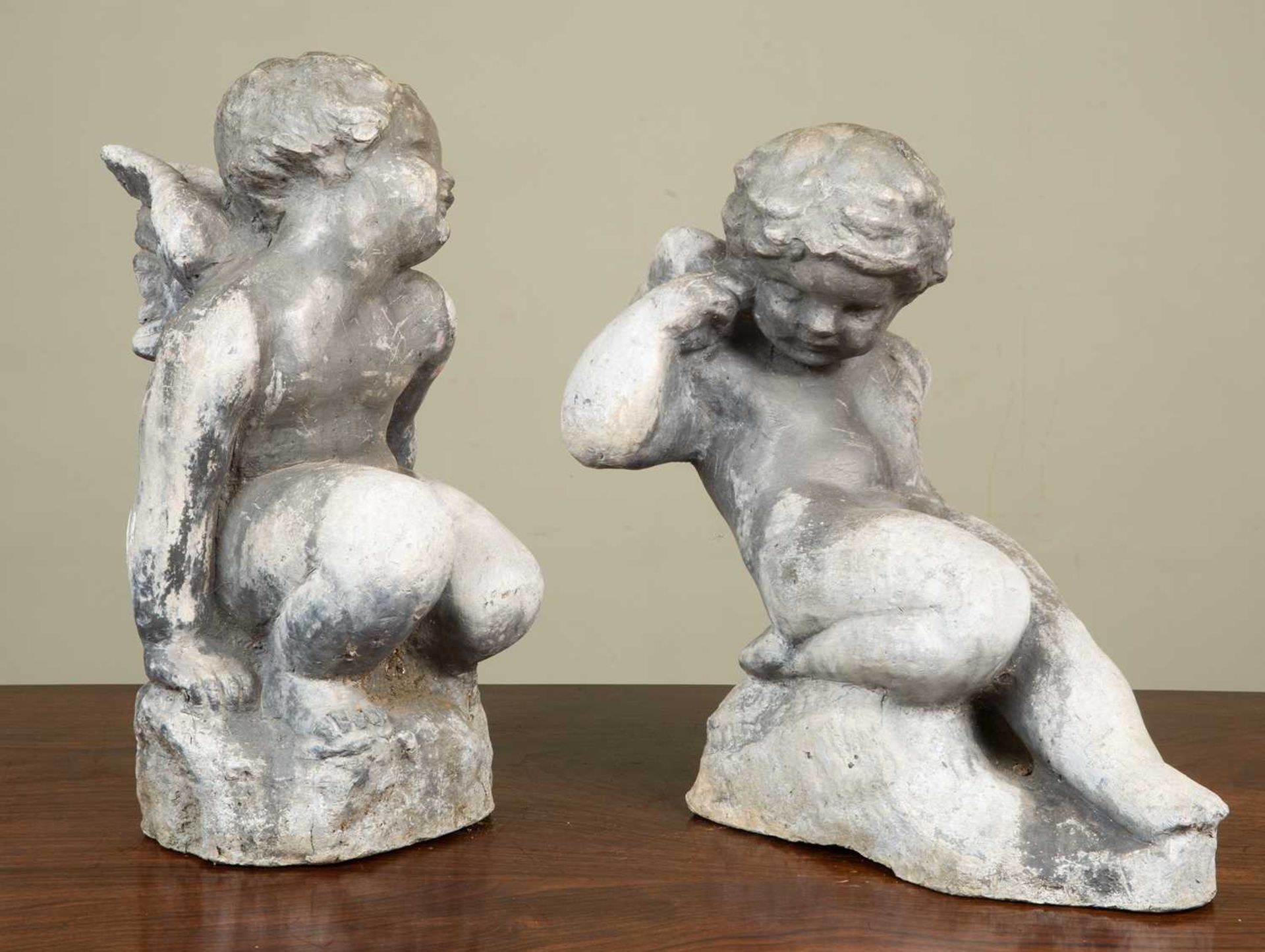 Two antique lead cherubs each in a playful pose, both approximately 36cm in height x 20cm wideSome - Image 2 of 4