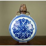 An antique Chinese porcelain moon flask, with restored spout and handles, 22cm wide x 30cm