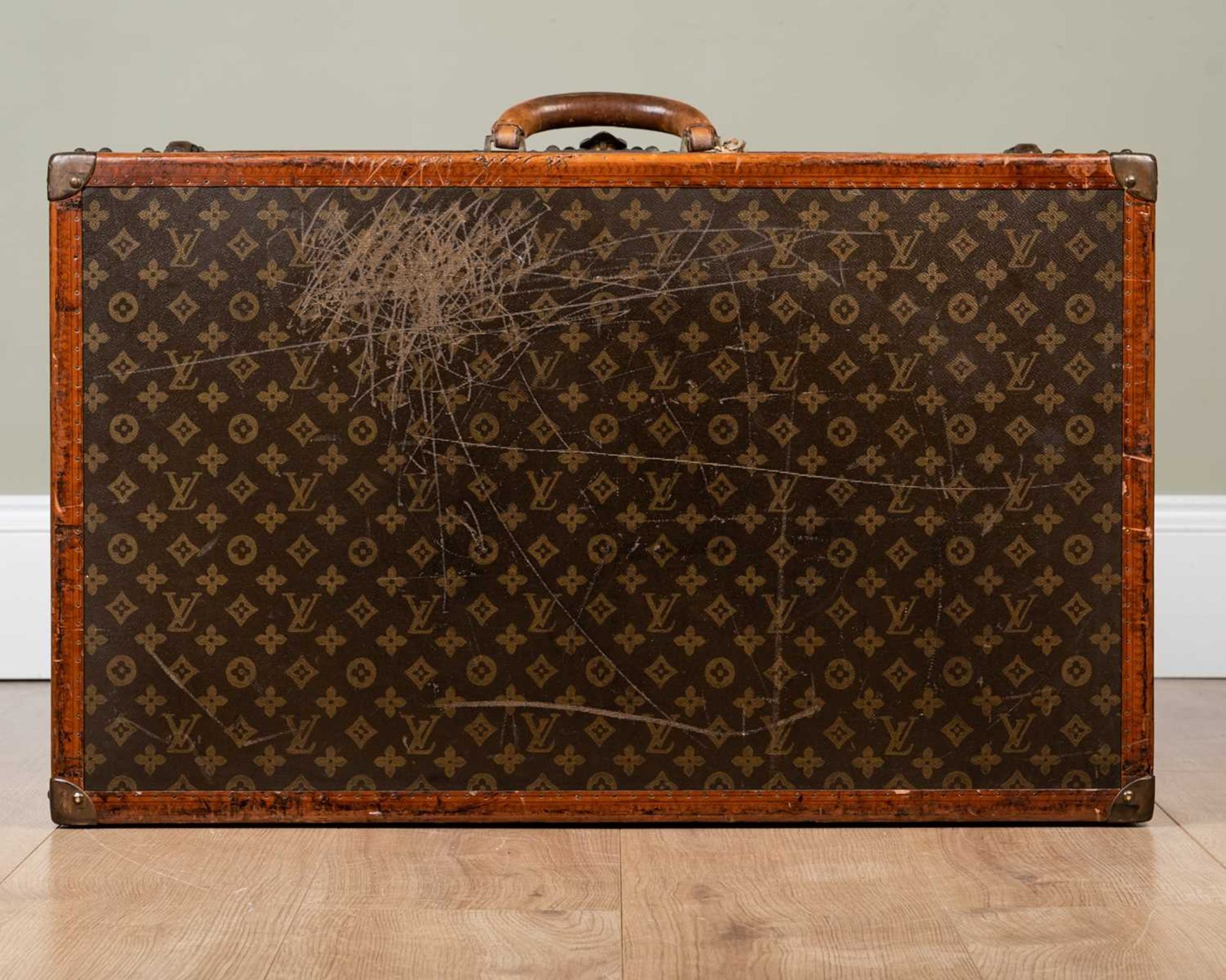 A vintage Louis Vuitton suitcase, early 20th century, with leather carrying handle, the lock - Image 4 of 11