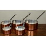 A set of five graduated copper saucepans with tin lining, each stamped ‘Fabrication Française’ to