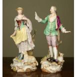 A pair of late 19th/early 20th century Meissen figurines depicting a gentleman singing to his belle,