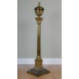 A Victorian heavy and substantial gilt brass lamp standard of Corinthian column form on a stepped