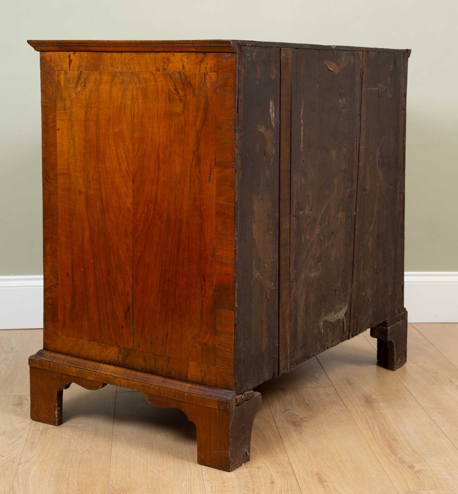 A George II walnut chest of two short and three long drawers standing on bracket feet, the quartered - Image 4 of 5