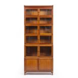 An early 20th century Minty style mahogany bookcase with ten glazed doors and two panelled doors,