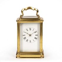 A 19th century French gilt brass carriage clock with white enamel roman dial and breguet hands,