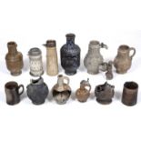A collection of 16th and 17th century salt glazed stoneware bottles, vases and sherds one dated 1581