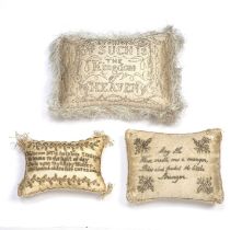 Three 19th century rectangular silk pin cushions two with welcoming messages, the largest 22cm x