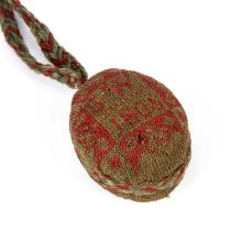 An early 19th century woollen needlework pin ball marked SW and dated 1805, the ball 5cm x 4cmTwo