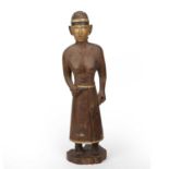 A late 19th/early 20th century Nicobar Islands female figure, in carved hardwood with pigment and
