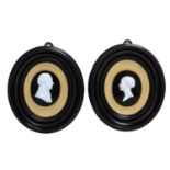 A pair of 19th century carved cameo silhouette portraits of a man and wife in Walter Jones, London