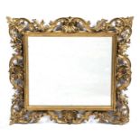 An antique Venetian gilt wood framed wall mirror 65cm x 71cmSome small chips and marks
