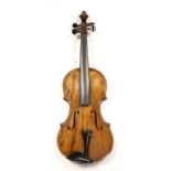 An early 20th century Violin, with a single piece back, cherub decoration and an indistinct