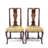 A pair of antique George I style walnut side chairs each with satinwood inlaid splats, embroidered