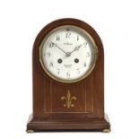 An Edwardian mahogany mantel clock with convex white enamel Arabic dial signed Benson, Ludgate Hill,