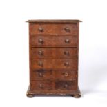 An early Victorian scumbled pine small sized chest of six drawers with turned knob handles and