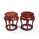 A pair of late 19th/early 20th century Chinese red lacquered occasional tables or plant stands, 44cm