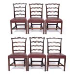 A set of six Chippendale style mahogany ladder back dining chairs with red leather seats, 53cm