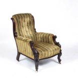 An early Victorian upholstered library armchair with acanthus scrolling arms, cabriole legs