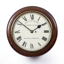 An early 20th century eight-day wall clock having a fusee movement, the enamelled dial with roman