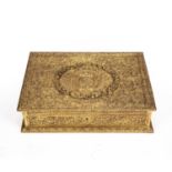 An antique gilt metal dressing table box, the lid having William III coat of arms, all over chased
