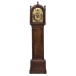 A 19th century oak eight day longcase clock, the brass break arch dial with Roman chapter ring,